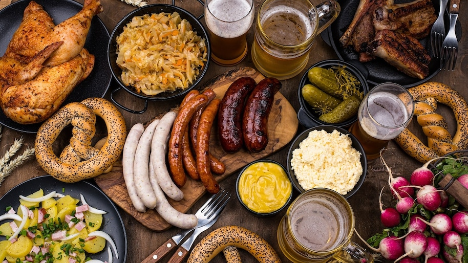 oktoberfest-dishes-with-beer-pretzel-and-sausage-2021-08-28-19-24-42-utc